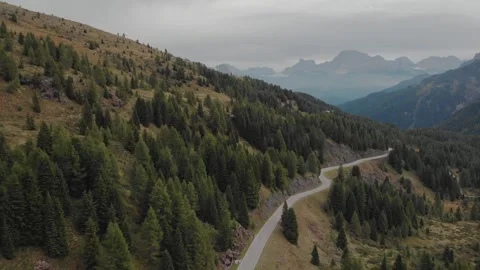 Aerial view of a road in mountains on cloudy day Video stock 147362322