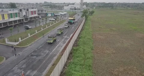 Aerial view on the road rollers working on the new road construction site Stock Footage 170413696