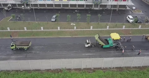 Aerial view on the road rollers working on the new road construction site Stock Footage 170413926
