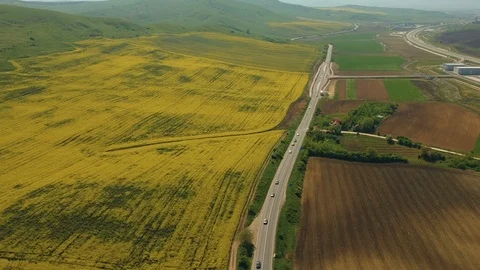 Aerial view of the road in the spring field Stock Footage 89383990
