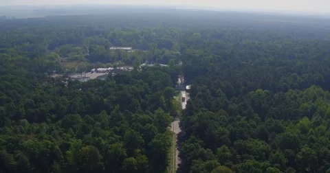 Aerial view of the road through green forest. Meat factory Stock Footage 68205239