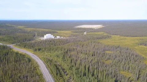 Aerial view of road through remote landscape of Alaska with mysterious Stock Footage 115365271