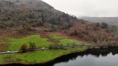 Aerial view of a road through a vibrant landscape with serene natural beauty. Stock Footage 293154803