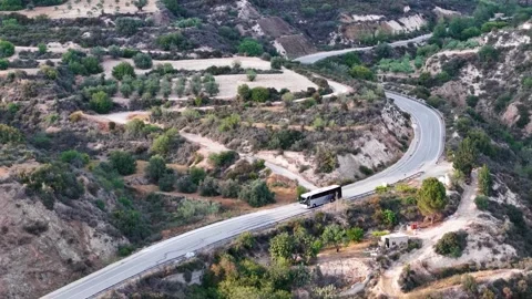 Aerial view of the road on which the bus is traveling. Stock Footage 310105117