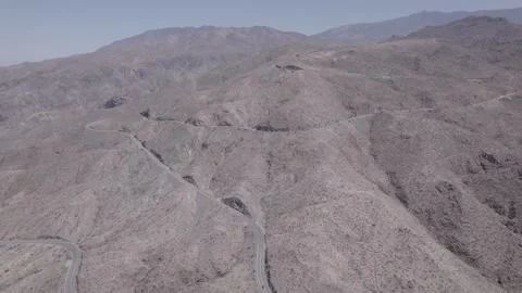 Aerial view of road winding through mountains Stock Footage 246336870