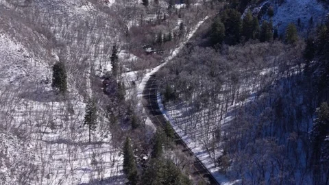 Aerial view of a road winding through Millcreek Canyon in Utah, USA Stock Footage 333881137