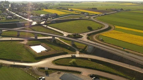 Aerial view - roads in the fields during sunset in the spring Stock-Footage 129569850