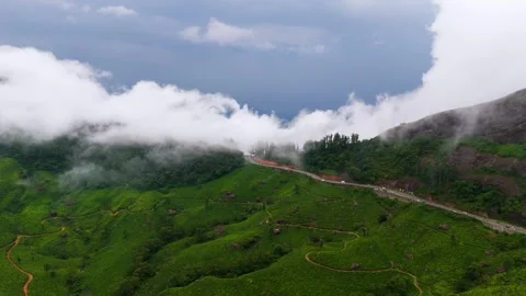 Aerial View of  Roads in Munnar Surrounded by Tea Plantations and Clouds Видео 341311619
