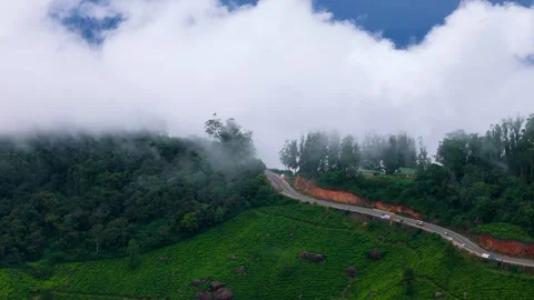 Aerial View of  Roads in Munnar Surrounded by Tea Plantations and Clouds Видео 341311633