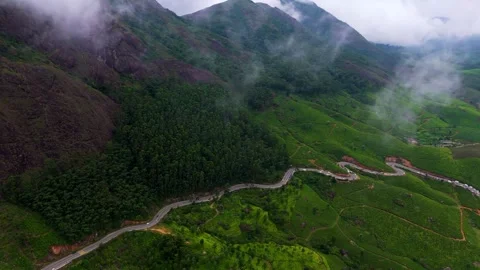 Aerial View of  Roads in Munnar Surrounded by Tea Plantations and Clouds Видео 341311665