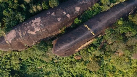 Aerial view on the rock cliff like three whales Stock Footage