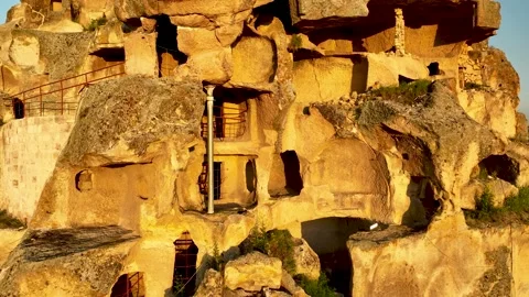 Aerial View of a Rock Cut Castle and Surrounding Landscape in Cappadocia 库存影片 218673796