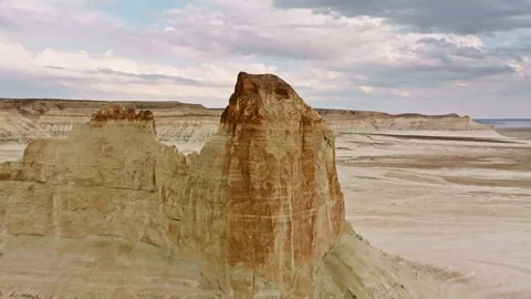 Aerial view of rock formations in arid landscape with dramatic cloud patterns Stock Footage 337423717