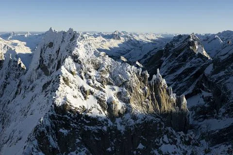 Aerial view of rock pinnacles of majestic Sciora di Dentro mountain, Val Stock Photos
