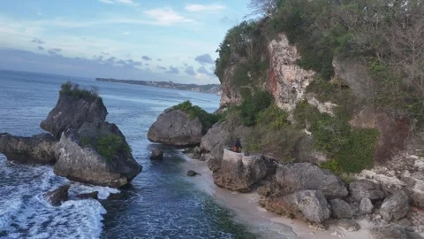 Aerial view of rocks on the coast on Thomas beach, Bali, Indonesia Stock Footage 284788944