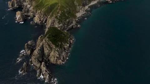 Aerial view, Rocks, Pacific Ocean, Grassland on the mountains, Bay Stock Footage 162638378