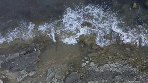 Aerial view of the rocks with sea waves Stock Footage 168079697