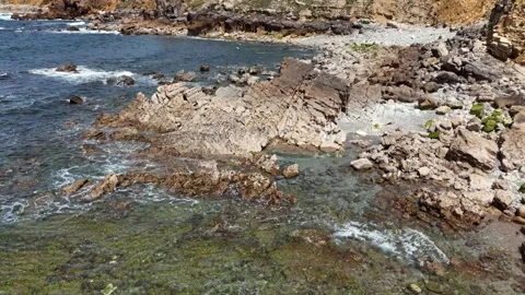 Aerial View of a Rocky Cliff Edge Overlooking the Atlantic Ocean Vídeos de archivo 345841093