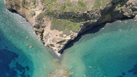 Aerial view of a rocky cliff, Milos island, Greece Stock Footage 220175813