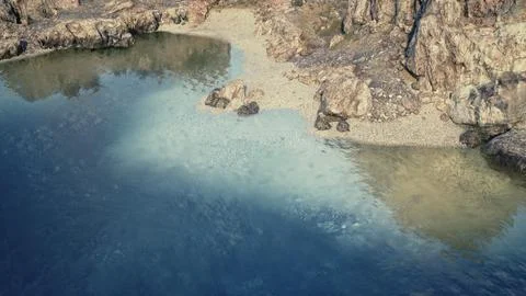 Aerial View of Rocky Cliffs Overlooking a Body of Water Stock Illustration