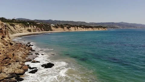 Aerial View of Rocky Cliffside Beach in California Stock Footage 146103450