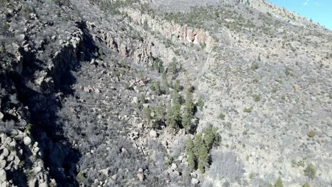 Aerial View of Rocky Mountain Cliffs and Arid High-Altitude Landscape Video stock 304090027