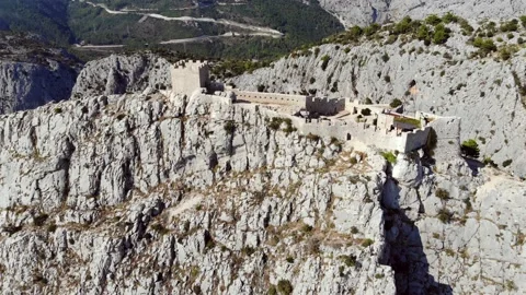 Aerial View Of Rocky Mountain Range And Historic Fortress Stock Footage 130232140