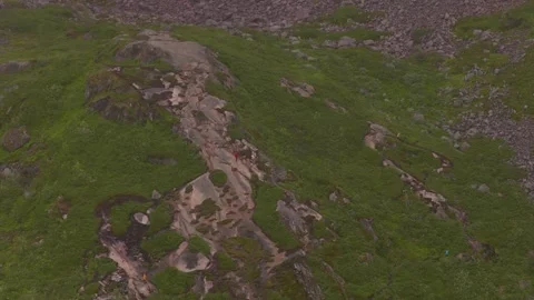 Aerial View of Rocky Mountain Stream and Alpine Meadow in Lofoten Stock Footage 337073089
