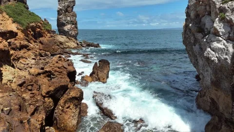Aerial View of a Rocky Sea Stack Framing the Atlantic Ocean Stock-Footage 345841891