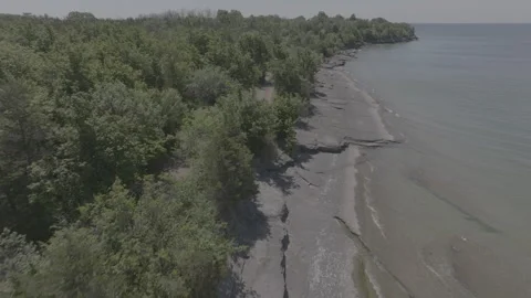 Aerial View of Rocky Shoreline and Clear Water near Point Petre, Ontario Stock Footage 312350853