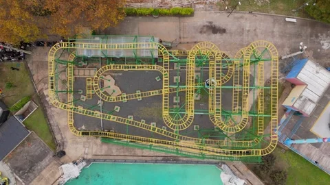 Aerial View of Roller Coaster Train on Track at Parque de la Costa, Argentina Stock Footage 336439889
