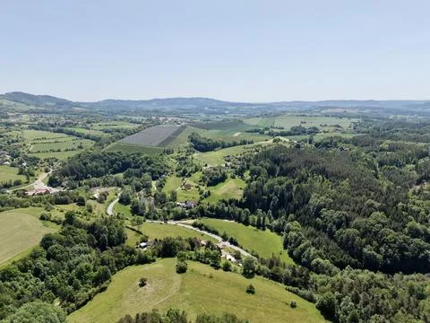 Aerial view of rolling countryside with fields and forests Stock Photos