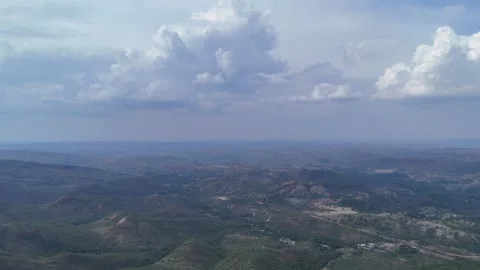 Aerial View of Rolling Hills and Forest Landscape Stock Footage 325593471