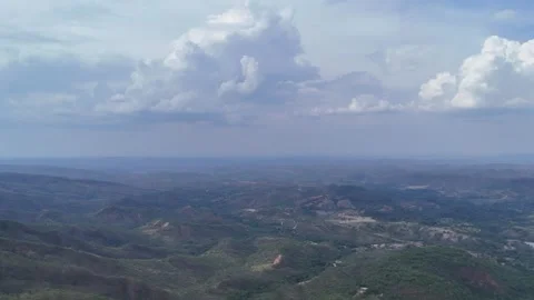 Aerial View of Rolling Hills and Forest Landscape Stock Footage 325593472