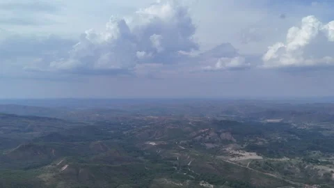 Aerial View of Rolling Hills and Forest Landscape Stock Footage 325593476