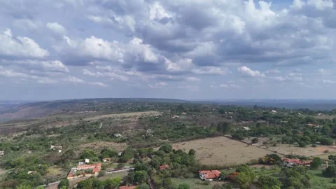 Aerial View of Rolling Hills and Forest Landscape Stock Footage 325593530