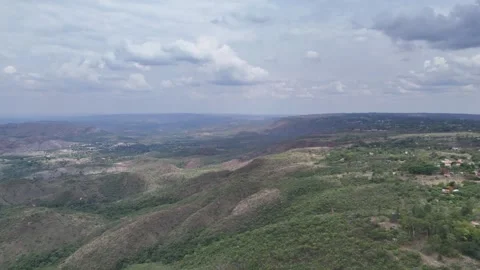 Aerial View of Rolling Hills and Forest Landscape Stock Footage 325593609