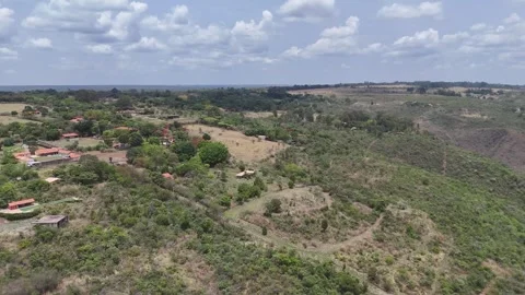 Aerial View of Rolling Hills and Forest Landscape Stock Footage 325593724