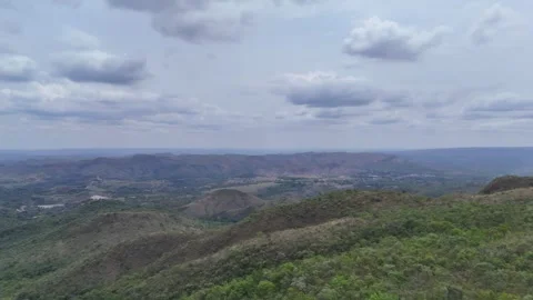 Aerial View of Rolling Hills and Forest Landscape Stock Footage 325593791
