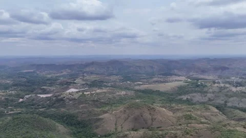 Aerial View of Rolling Hills and Forest Landscape Stock Footage 325607996