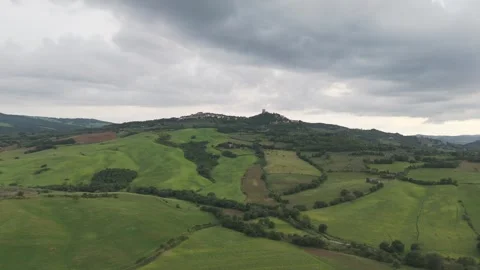 Aerial View of Rolling Hills and Medieval Village in Tuscany Italy Stock Footage 335704579