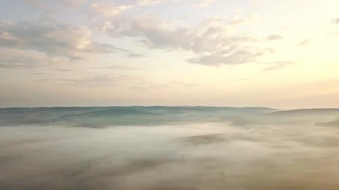 Aerial view of rolling landscape in a soft early morning light. Stock Footage 95005344