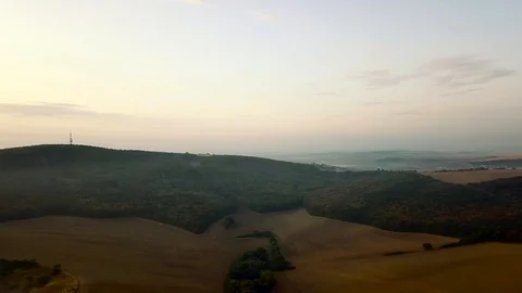 Aerial view of rolling landscape in a soft early morning light. Stock Footage 95005506