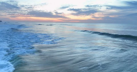 Aerial view of rolling ocean waves at sunset in Portugal. Drone flying over the Stock Footage 221721608