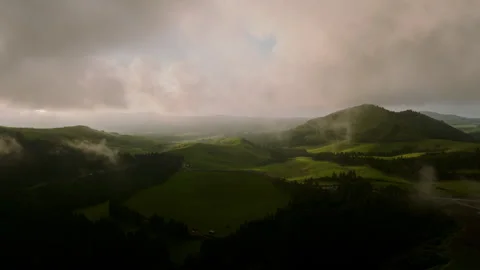 Aerial view of the rolling, vibrant green volcanic landscape of Sao Miguel Stock-Footage 336192633