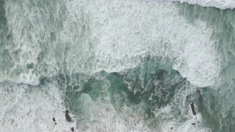 Aerial view of rolling waves along the shore, Cascais, Lisbon, Portugal. Stock Footage 219525147