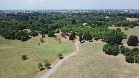 Aerial view Rome - A guy running in a park under summer sun Stock Footage 92015723