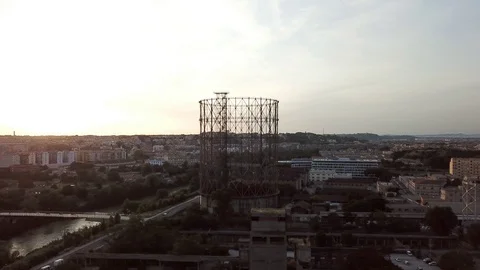 Aerial view, Rome at sunset, River, bridges and the Gasometer in an old district Stock Footage 90643226