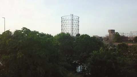 Aerial view, Rome at sunset, River, bridges and the Gasometer in an old district Stock Footage 90643311
