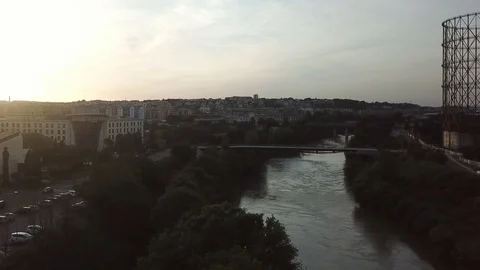 Aerial view, Rome at sunset, River, bridges and the Gasometer in an old district Stock Footage 90645010
